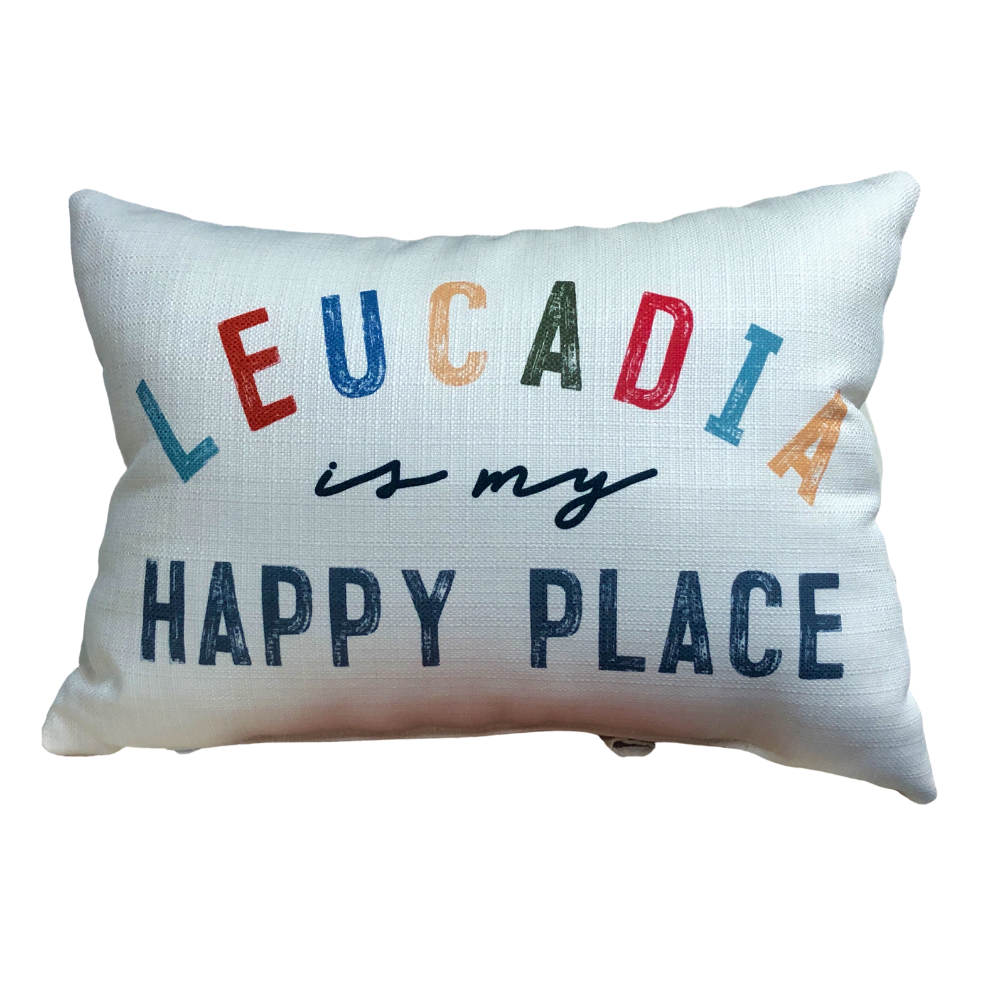 Cream pillow with words "Leucadia is my happy place"